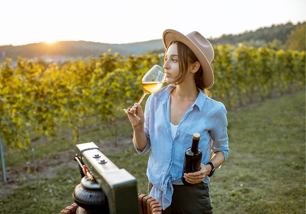 young-woman-drinking-wine-vineyard